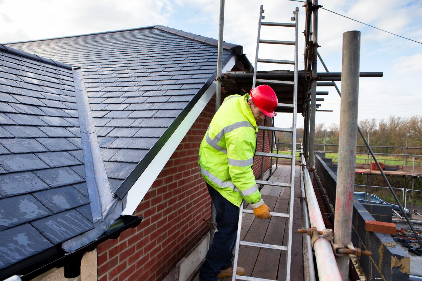 Roofer working on a UK slate roof