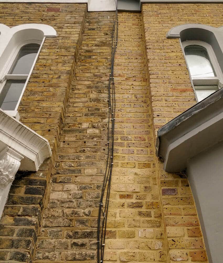Brick repointing on a British wall